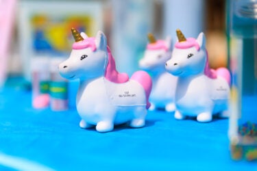 Unicorn squeeze toys with the CST phone number.