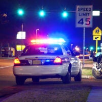 Motorcycle pulled over at night for a police traffic stop