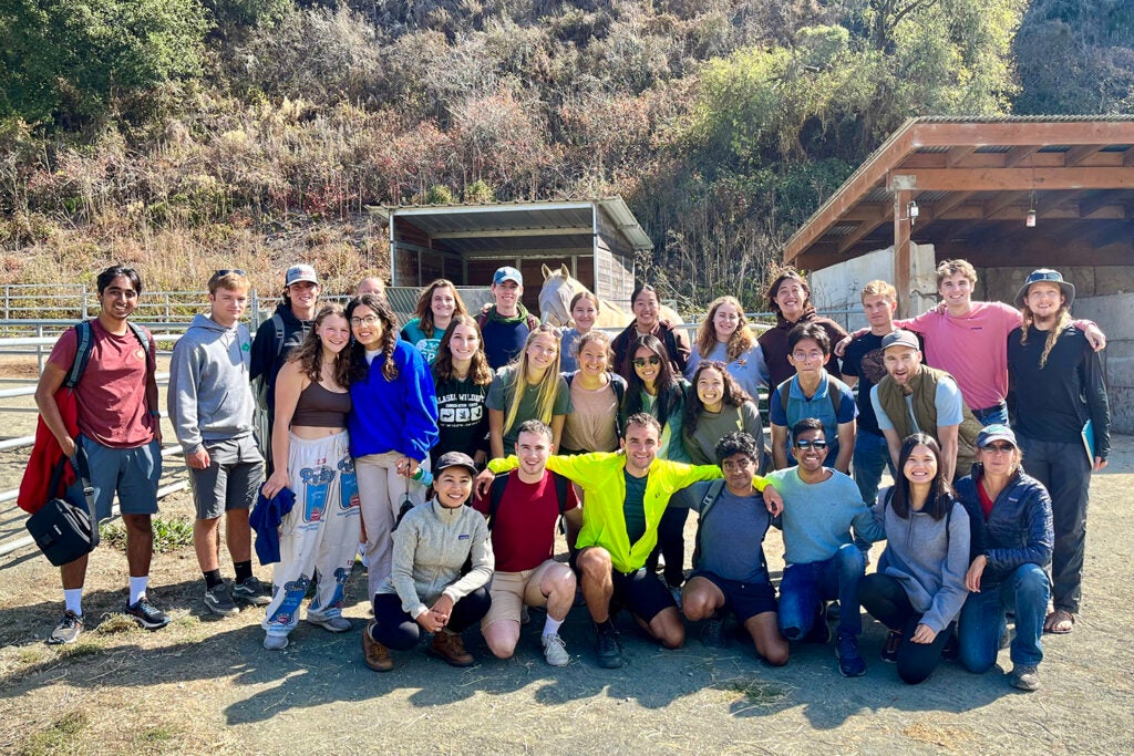 Residents from the Outdoor House pose for a group photo during a trip learning about regenerative ranching at the TomKat Ranch, an 1,800-acre grass fed cattle ranch in Pescadero, California.
