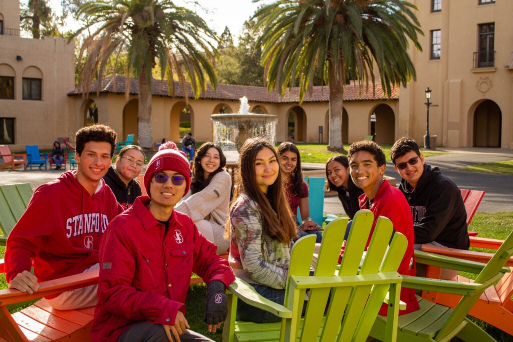 Students seated together outdoors.