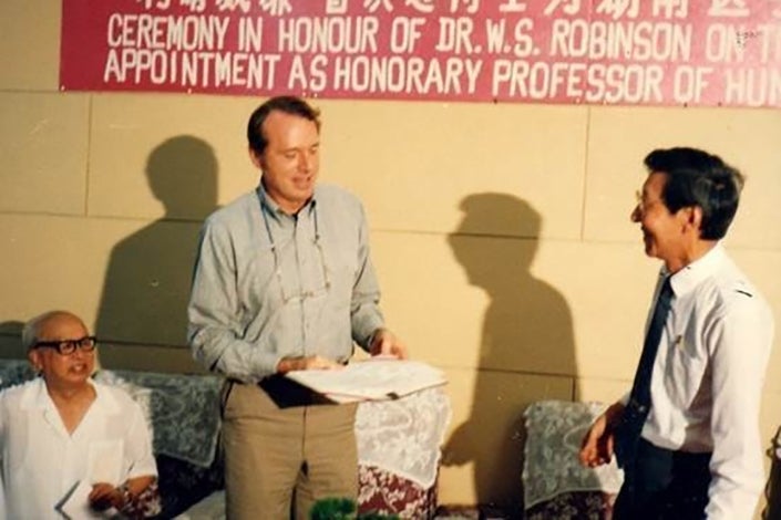 William Robinson receives an award in China.