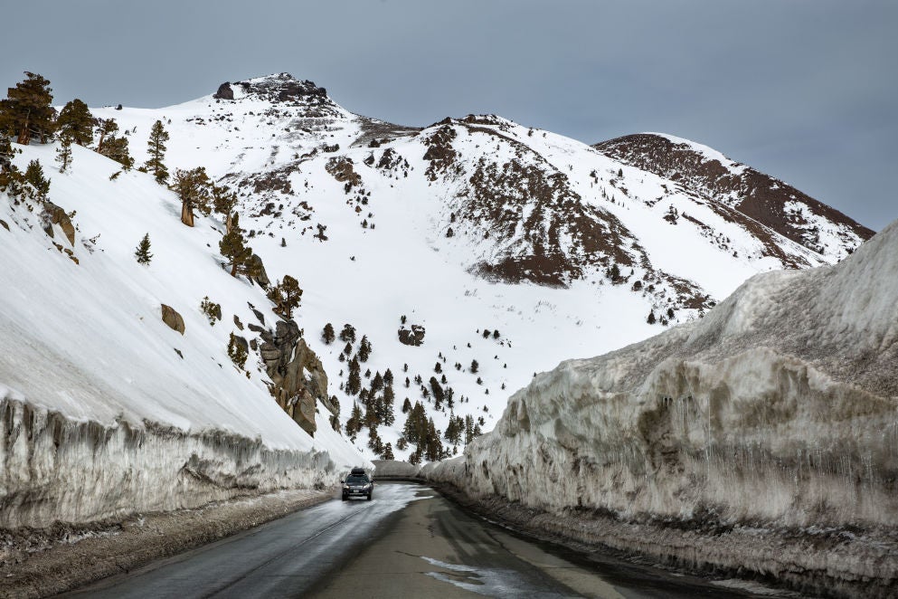 HOPE VALLEY, CA - APRIL 8: Canyons of snow greet drivers on Highway 88 as they cross the Sierra Nevada Crest over Carson Pass on April 8, 2022, near South Lake Tahoe, California. With record snow of 20-40 feet in many places this winter, communities in the Sierra Nevada are still digging out even as the temperatures rise and the snow begins to melt.