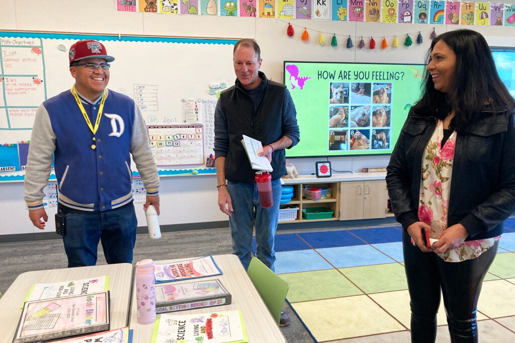 Jonny Hernandez, a paraeducator at Abram Agnew Elementary School, with Chris Lemons and Lakshmi Balasubramian.