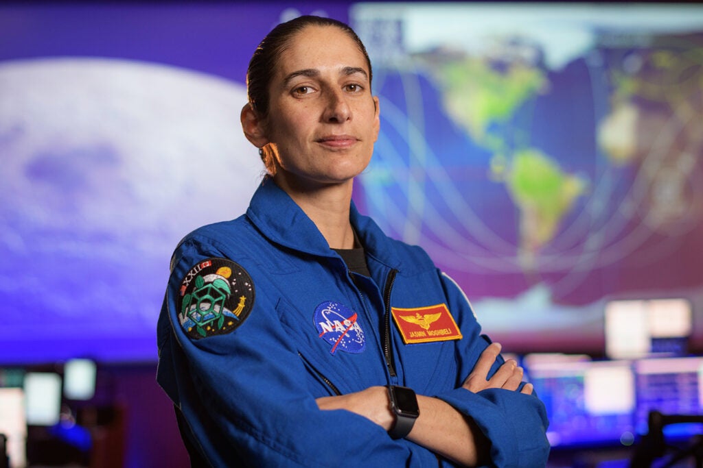 NASA astronaut Jasmin Moghbeli poses for a portrait, Tuesday, Sept. 8, 2020, in the Blue Flight Control Room at NASA’s Johnson Space Center in Houston.