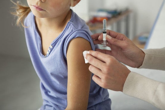 girl receiving vaccination / Image Point Fr/Shutterstock