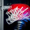 Multi-exposure of a football helmet simulating impact on the top of the helmet. / Photo: L.A. Cicero