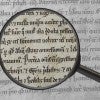 Magnifying glass over text of the Magna Carta/Photo illustration by L.A. Cicero