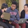 students Nikhita Obeegadoo, Eric Ehizokhale and Sophie Ye working on their laptops / L.A. Cicero