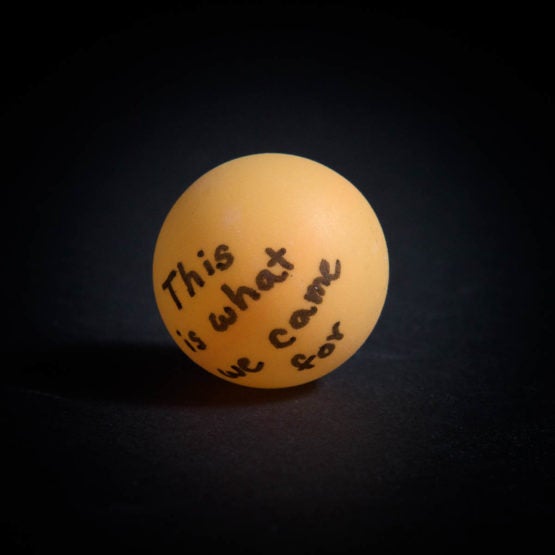 Ping pong ball with "This is what we came for" written on it