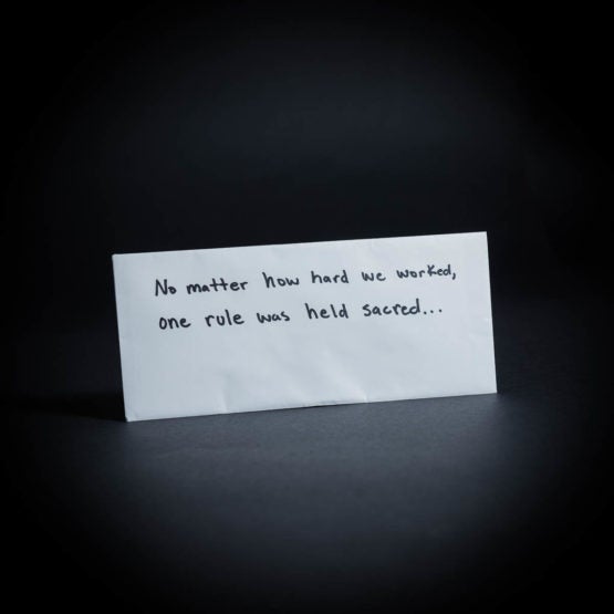 Envelope with "No matter how hard we worked, one rule was held sacred..." written on it in marker