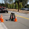 researchers testing autonomous vehicle on a street course
