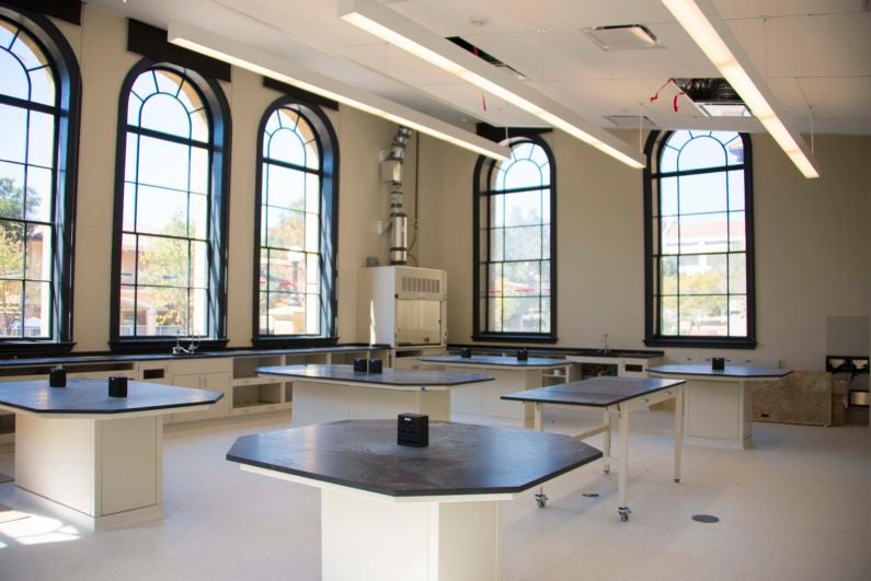 Lab classroom in large, open room with large windows offering view over campus