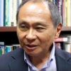 Francis Fukuyama with library books in background