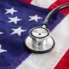 Healthcare reform concept with stethoscope and American flag