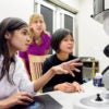 Fariah Hayee, Jen Dionne and Ai Leen Koh working at an electron microscope