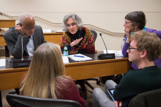Members of the Faculty Senate in discussion.