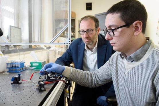Prof. Alberto Salleo and graduate student Scott Keene in the lab