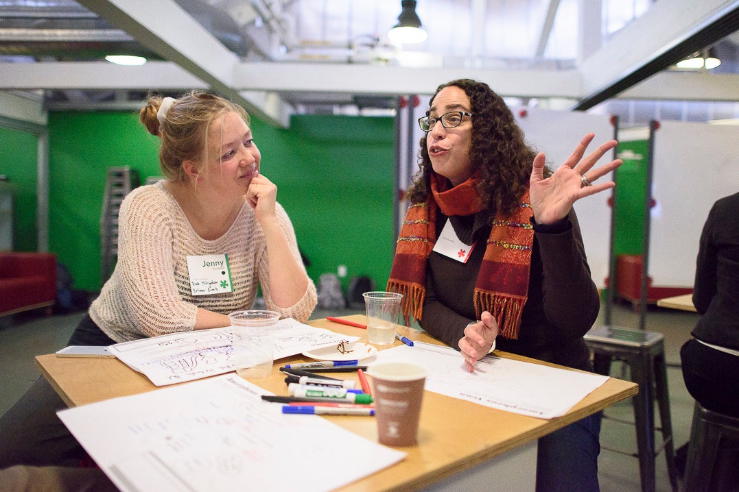 Jenny Suckale and Amalia Kessler in conversation at a desk during a Catalyst workshop at the d.school