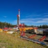 fracking rig near forested area