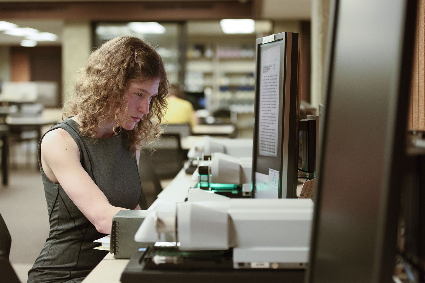 Anna Polishchuk translates documents from the original Russian at the Hoover Archives.