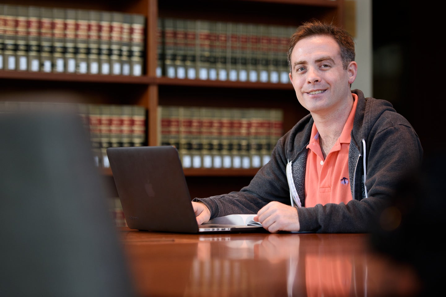Veteran and law student Benjamin E. Haas, studying at the Law School.
