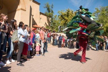 The Tree, mascot of the Stanford Band, dances and spins for the crowd outside Memorial Auditorium.
