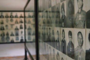 walls of photos of genocide victims