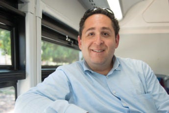 Brian Shaw, Director, Parking & Transportation Services, on the Marguerite shuttle bus.