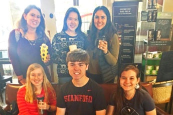 Six students posing with reusable coffee cups