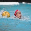Maggie Steffens with the ball in a water polo match.
