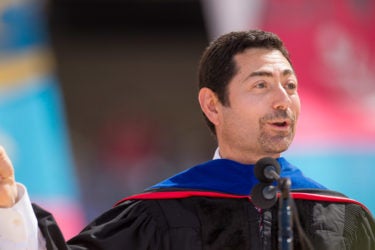Commencement speaker Mariano-Florentino Cuéllar encouraged the graduates to snap their fingers while he rapped part of his Commencement address.