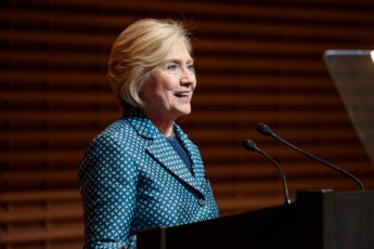Hillary Clinton speaking at podium