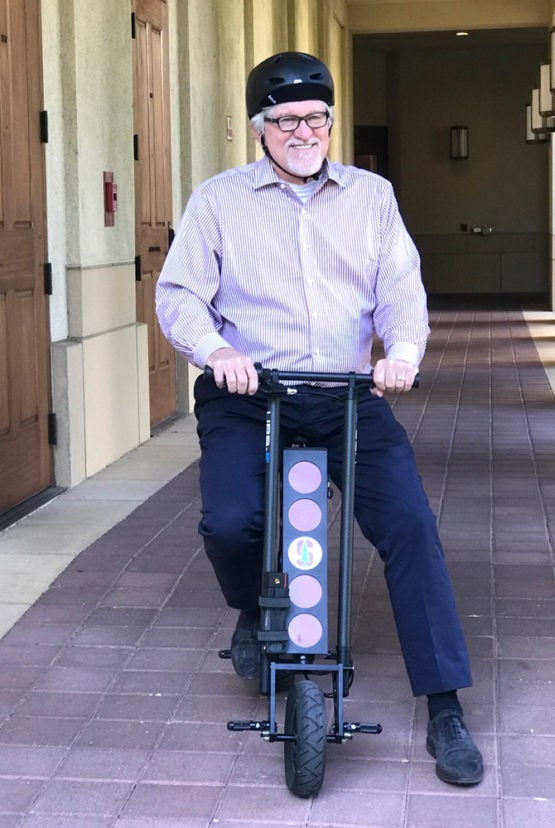 Jeff Raikes on scooter.