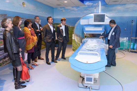 Members of the board at a demonstration of an MRI machine