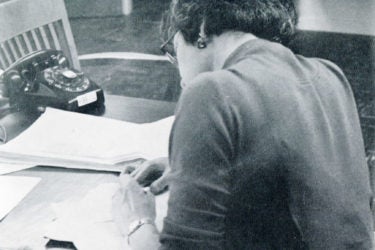 A 1959 photo shows an editor working at the press.