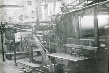 A 1959 photo shows a letterpress inside the facilities of Stanford University Press.