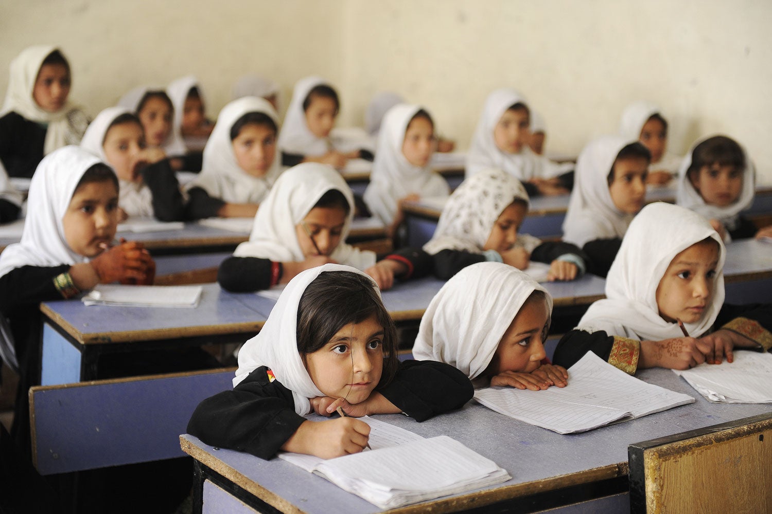 Young girls wearing head scarves attending school in Kandahar, Afghanistan.