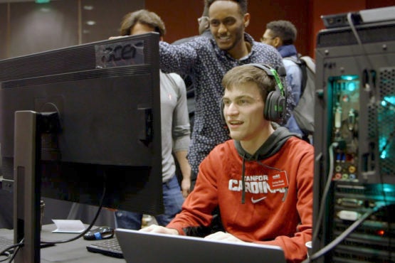 students in a videogame course play their game