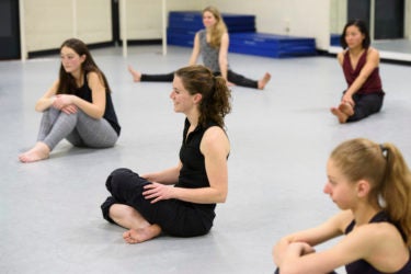 Dancers ask questions during the cool-down period at the end of the class.
