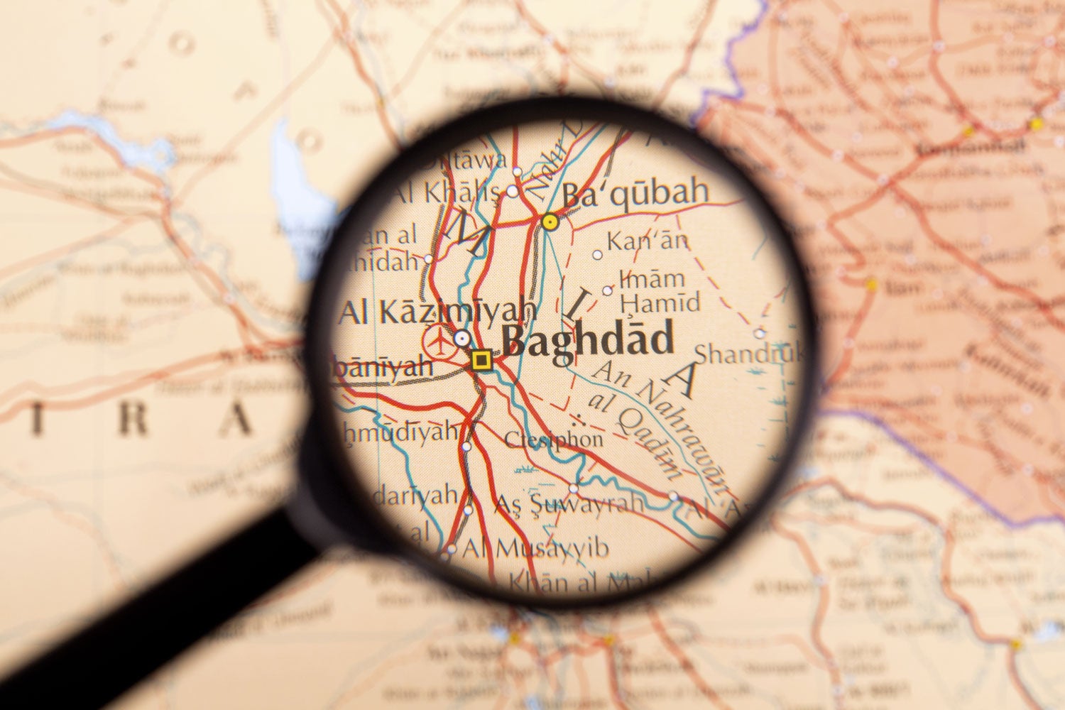 map of Iran with magnifying glass focused on Baghdad