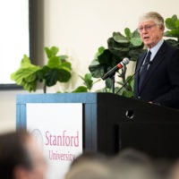 journalist Ted Koppel at the lectern speaking to a Stanford audience