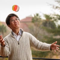 Takashi Tokieda bats about a kamifusen, or Japanese paper balloon, to inflate it
