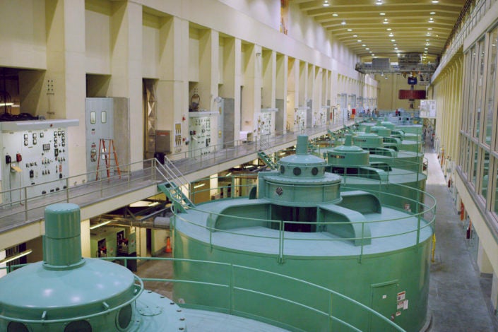 A series of large generators inside a dam)