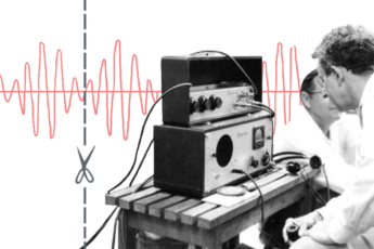 Engineers work with early audio electronics.