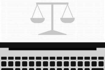 The scales of justice on a laptop screen.