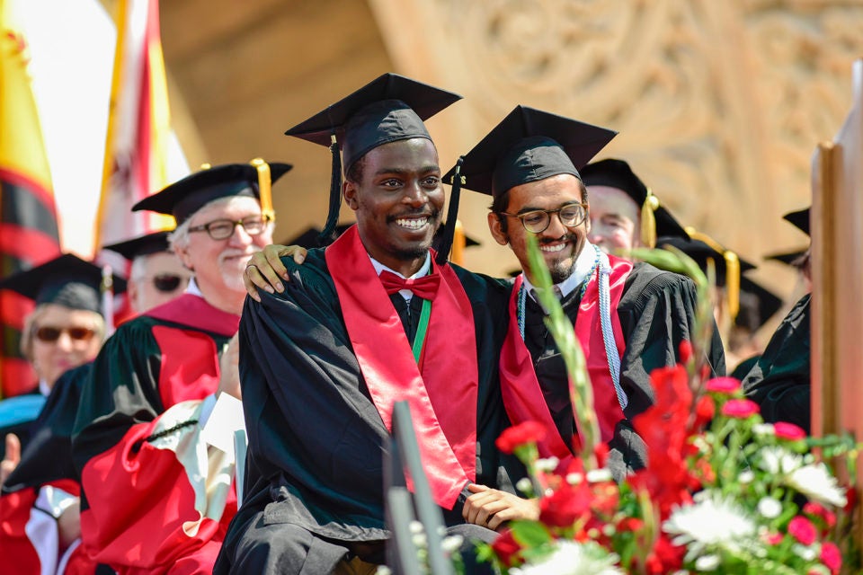 After giving the student reflection Eni Asebiomo is congratulated by fellow senior class president Ibrahim Bharmal. 127th Commencement Baccalaureate, Main Quadrangle