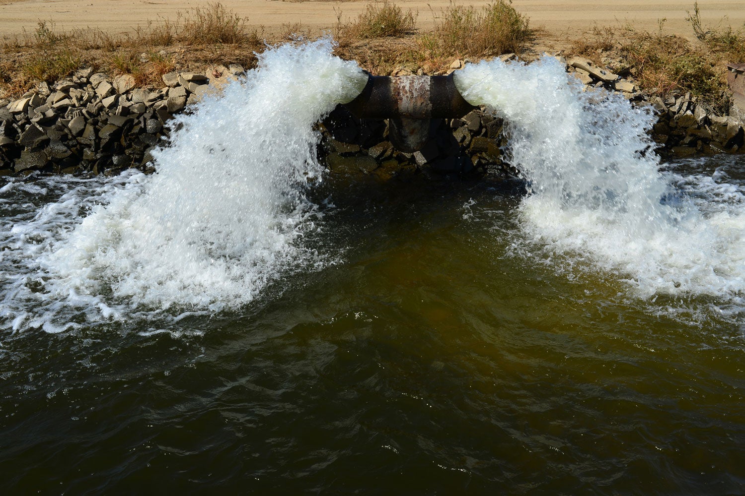 water pumping into irrigation ditch