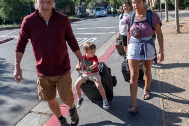 First-year student Maza Hixson moves into Stern Hall with the help of her family, including mom, Janice Hixson, and nephew Niall Blake, 2, who gets a ride from Jim Hixson, her dad.