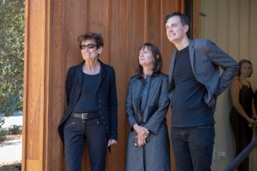 Artist Ursula von Rydingsvard, left, watches with Roberta and Robert Denning.