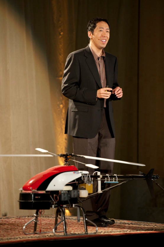 Ng on stage with one of his autonomous helicopters